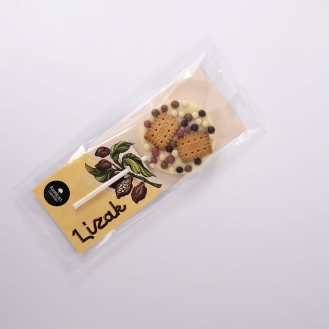 Lizak z czekolady białej z ciasteczkami leibniz i chrupiącymi kuleczkami 35 g